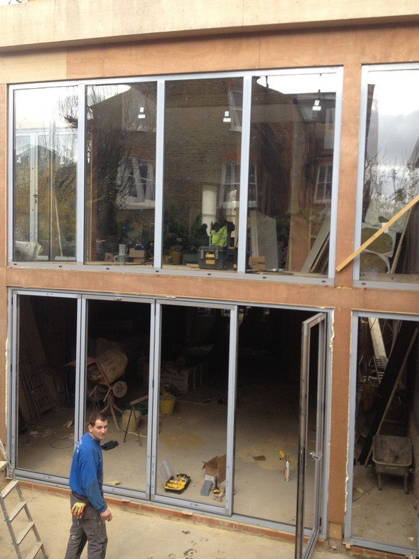 Aluminium bi-fold doors with two-storey glazing in Uxbridge