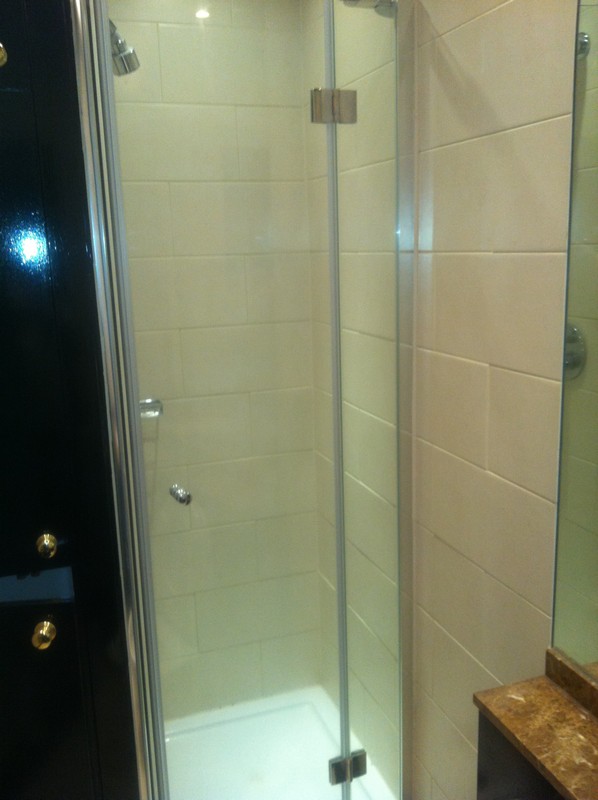 Frameless glass shower enclosure with chrome fittings in Uxbridge