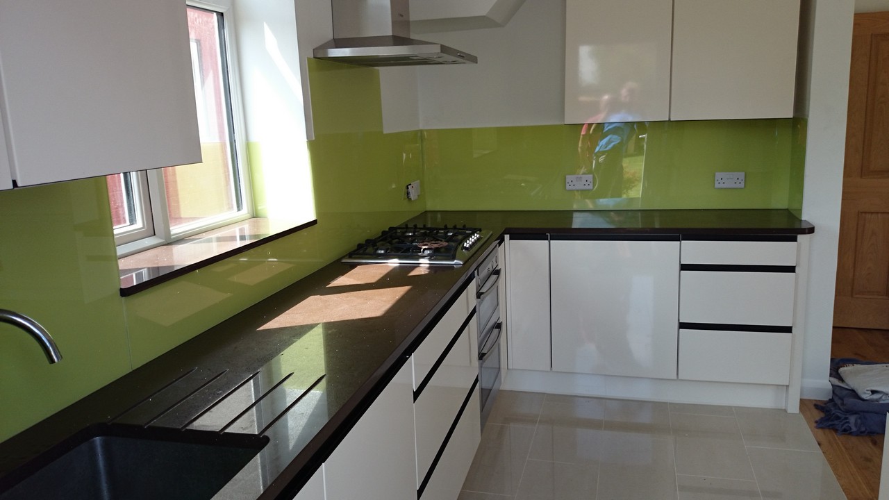 Lime green glass kitchen splashback installed by Uxbridge glaziers