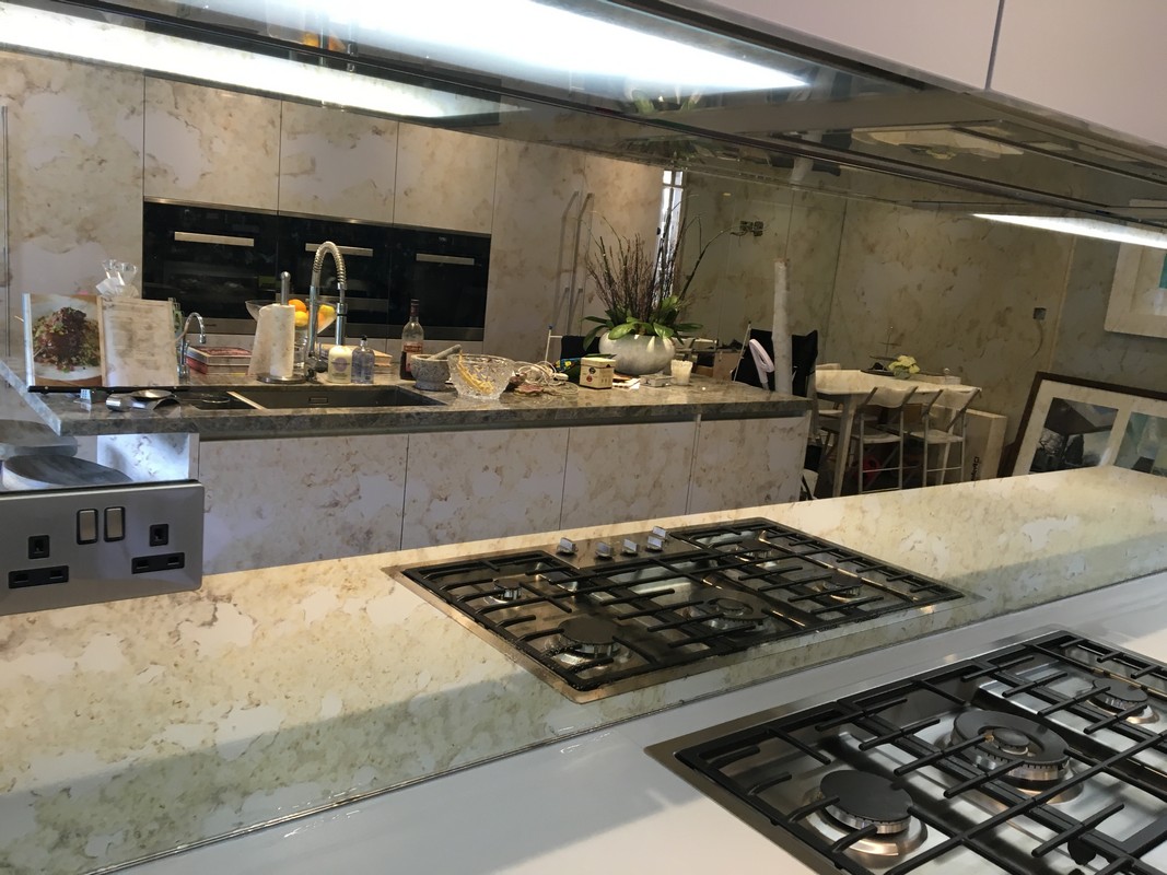 Mirror glass splashback in Uxbridge luxury kitchen