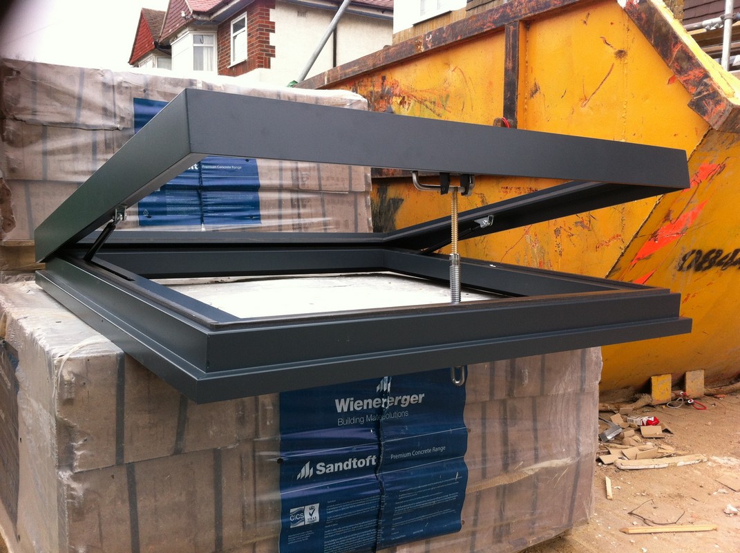 Opening flat roof skylight in anthracite grey installed in Uxbridge