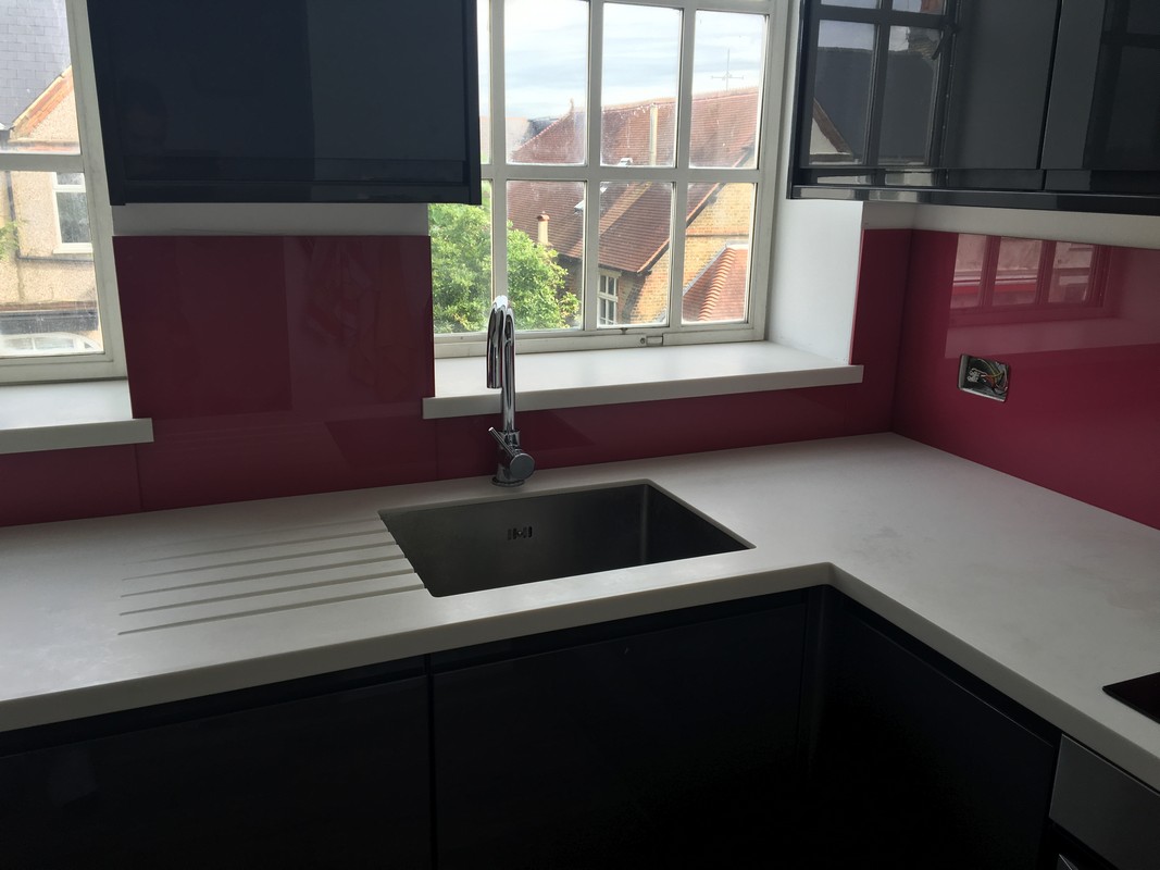 Deep plum coloured glass splashback in modern Uxbridge kitchen
